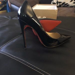 Black Louboutin’s size 38